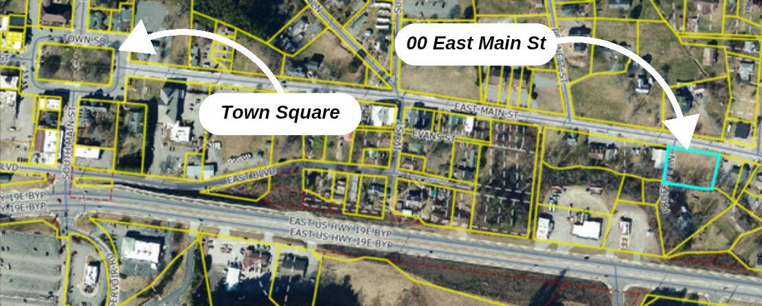 Commercial lot for sale at 00 East Main Street, Burnsville, NC. 0.67 acres zoned C3, with city water and sewer, located in the heart of Burnsville, ideal for business development. Offered at $275,000